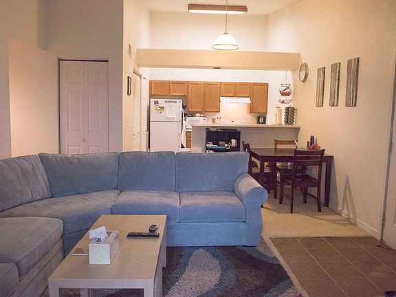 open living room to kitchen with vaulted ceilings