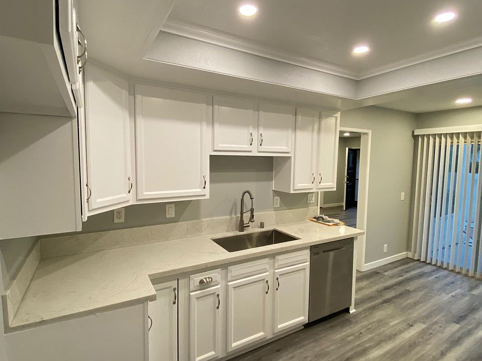 Kitchen with recessed lighting.