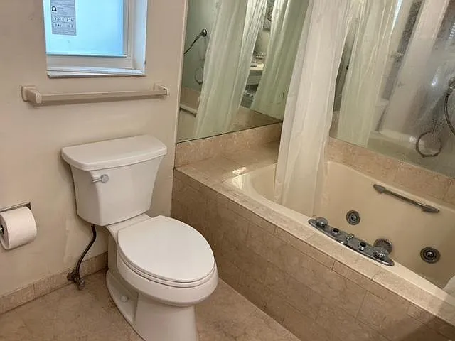 Large bathroom with tub and shower