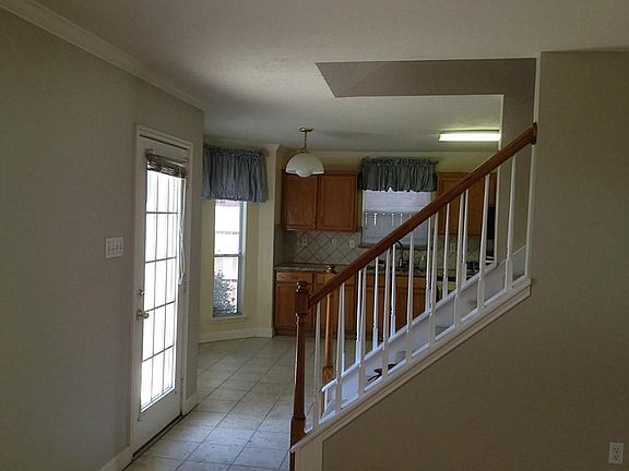 Walk into the breakfast room and kitchen. That's a good looking back splash above the granite, isn't