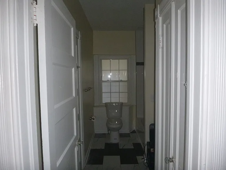 Newly renovated bathroom with tub/shower and linen closet.