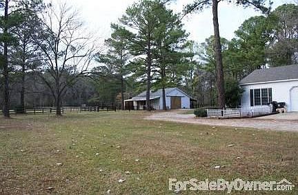 Barn
						:
						The barn is located behind the house. Includes 4 stalls, tack room & open space