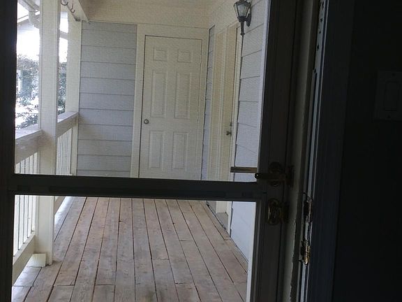 Balcony which leads to a large storage closet.