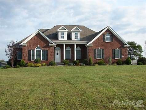 What gorgeous views from all sides of this 4 bedroom, 3 bath all brick home! Hardwood floors, tray ceilings, tile, fenced back yard, deck and a columned front porch combine to make this attractive home a must see! The whirlpool tub and walk-in closet with a tall custom maple double vanity enhance the Owner's Suite. All this on a private, convenient one acre lot!