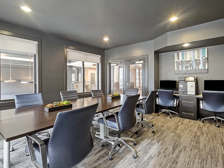 Contemporary conference space with ample seating and natural light