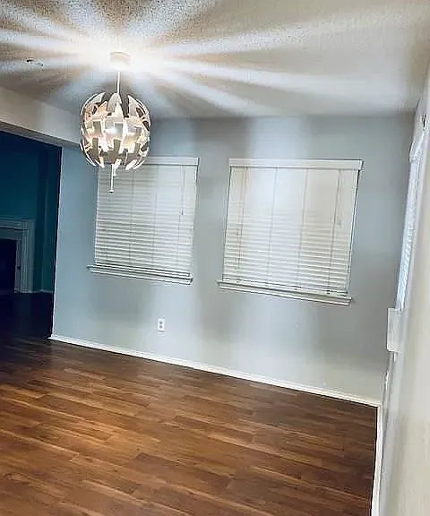 Dining room with modern chandelier.
