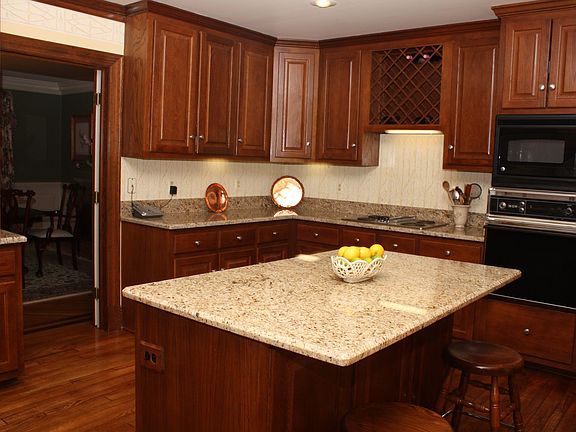Kitchen with new granite countertops and island.