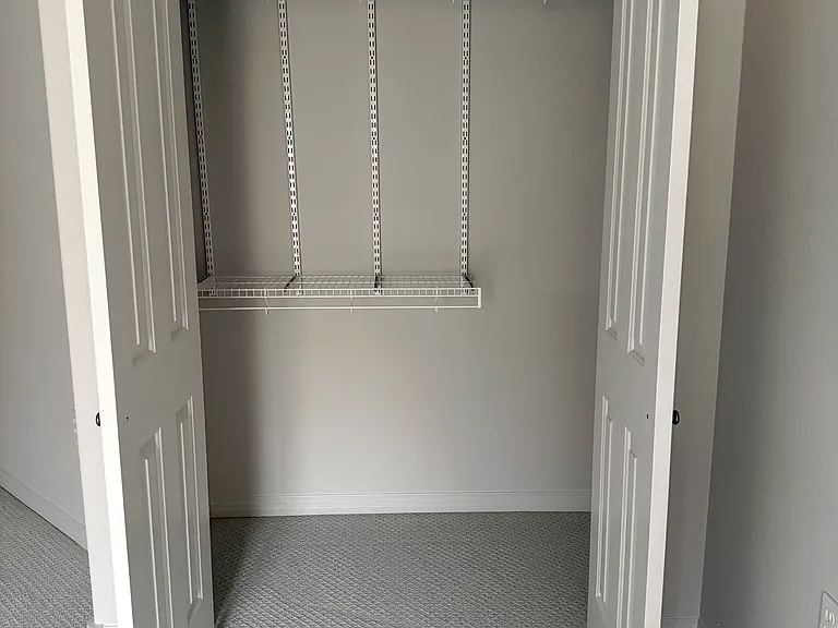 ONE OF TWO WALK IN CLOSETS IN MASTER BEDROOM