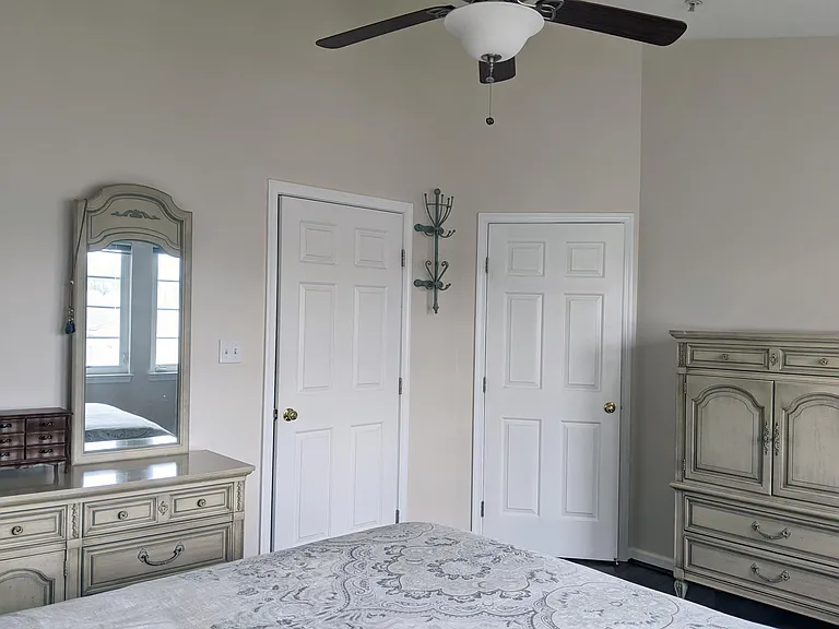Main Bedroom - view towards bedroom door and walk-in closet door