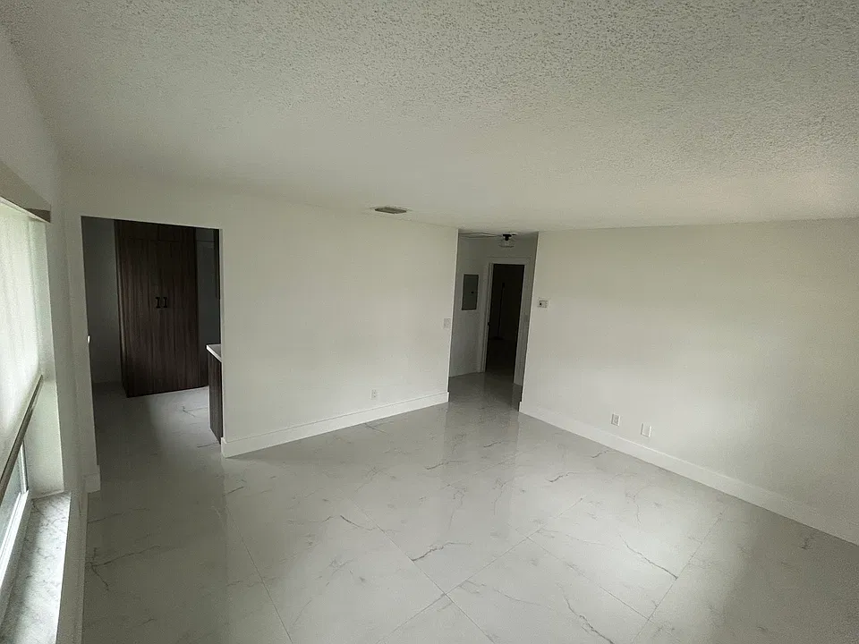 Front entrance to the living room. Brand new flooring