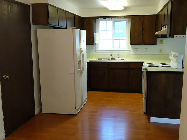 Looking from dining room into kitchen