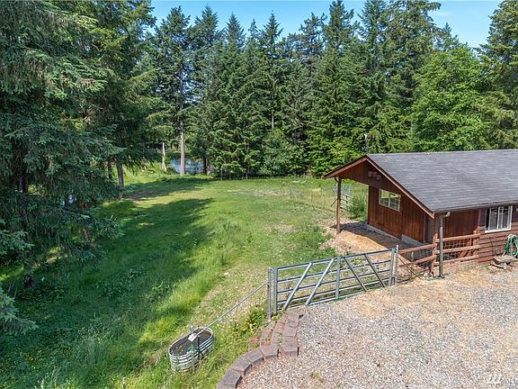Feed/tack barn with pastures and pond beyond. Beautiful isn't it!