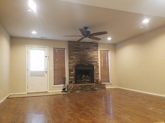 Real wood burning fireplace. Door exits onto the deck and backyard.