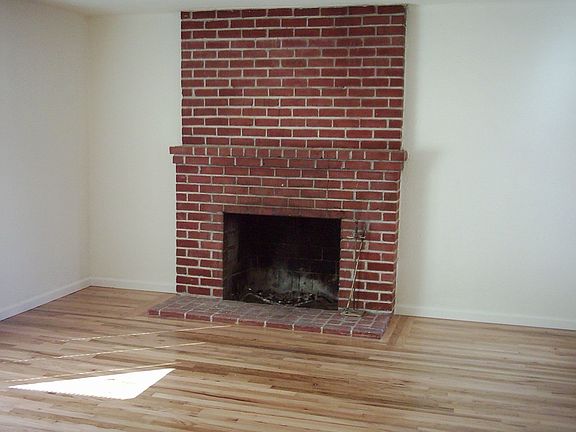Wood burning fireplace and hard wood floors