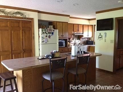 Kitchen
						:
						Large eat at island / HUGE pantry. Morning sun in the kitchen.