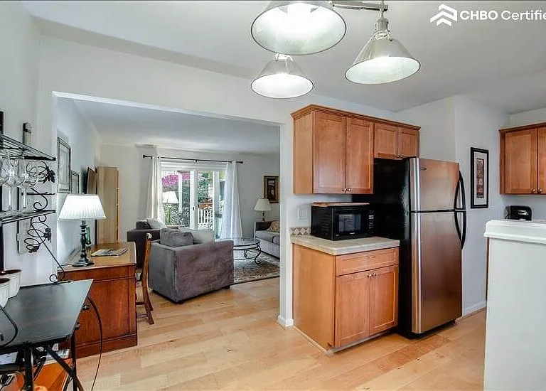 Contiguous light and airy dining area through to living room