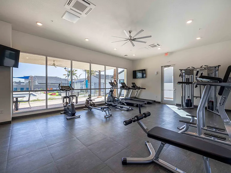 Stay fit in this state-of-the-art fitness center with natural lighting and cutting-edge equipment.