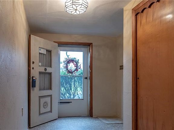 In addition to the double coat closet to the right, the large entry allows plenty of space for getting organized before moving o