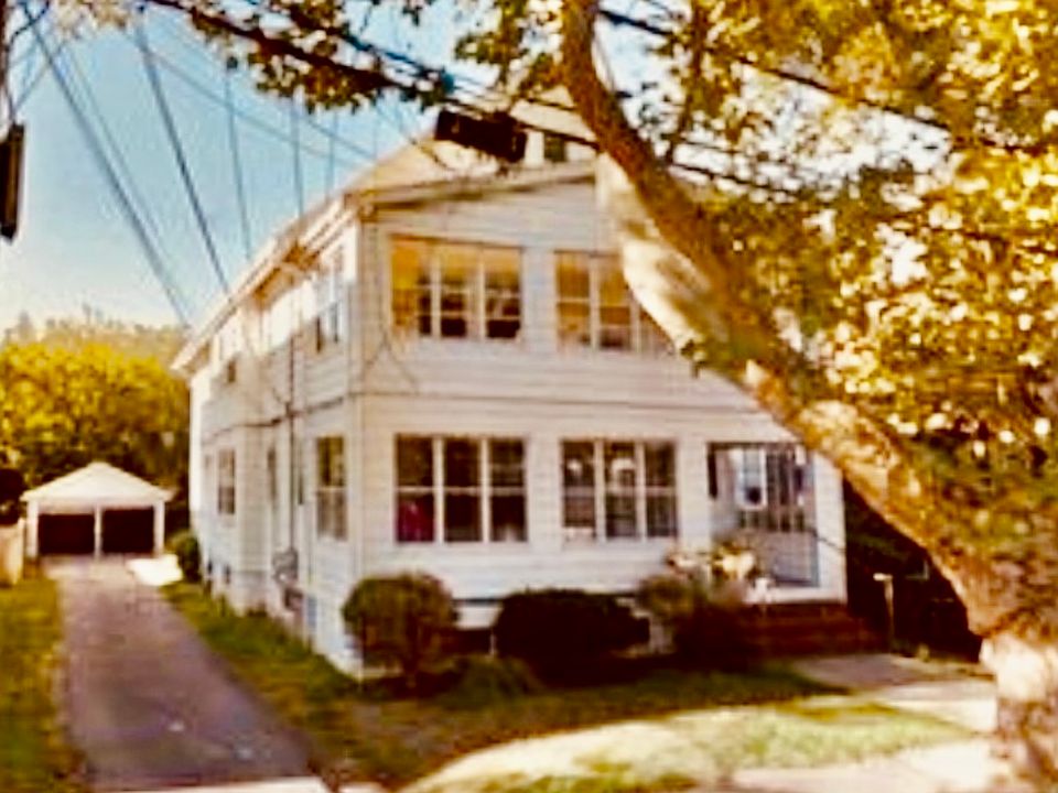 Charming sunny two family home with your private garage parking. Additional parking for a second vehicle directly behind your assigned spot.