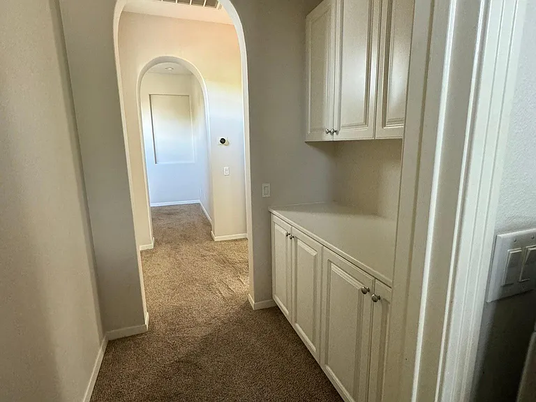 linen cabinets and master hallway