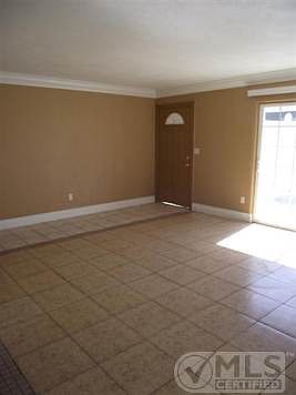 Front door and glass sliding doors to let in lots of light.  Up graded baseboards and paint.