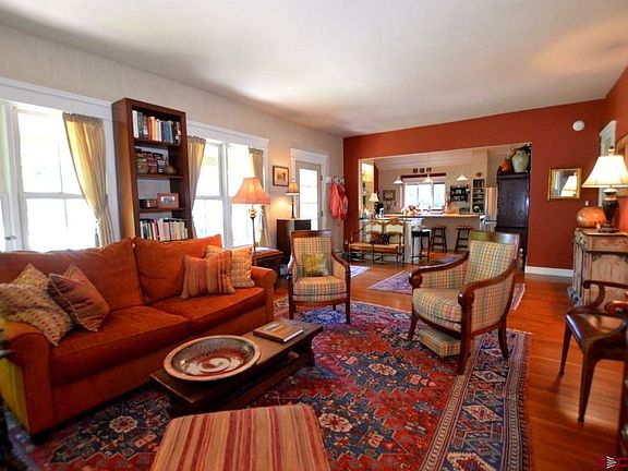 Open living space with an abundance of natural light during the day and cozy seating area at evening