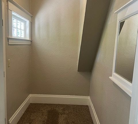 Formal entry from interior with front door closed. Window with period glass