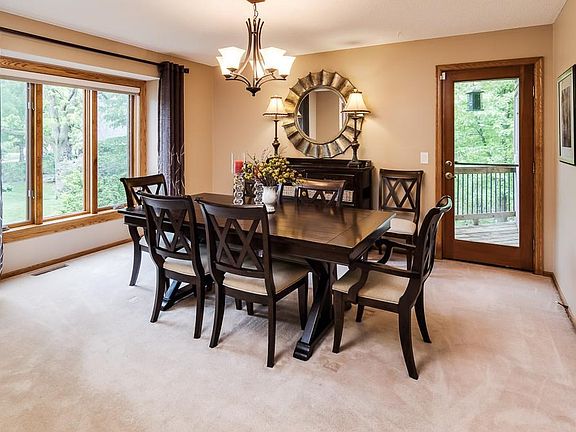 Entertain in this comfortable dining area.  The small private deck is a bonus!