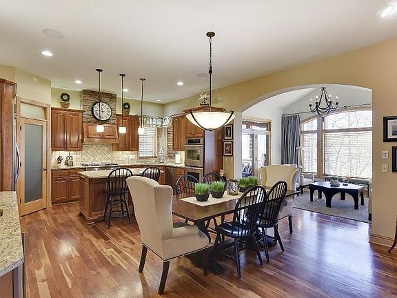 Open floor plan w/ high ceilings. Gleaming Cherry hardwood floors span the main level areas.
