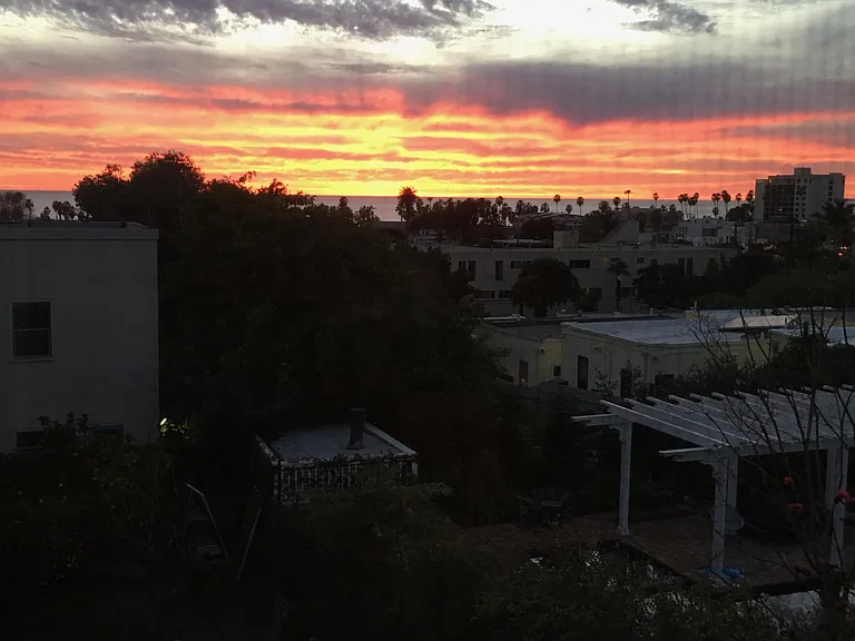 Sunset view of the ocean from the west facing enclosed sunporch.
