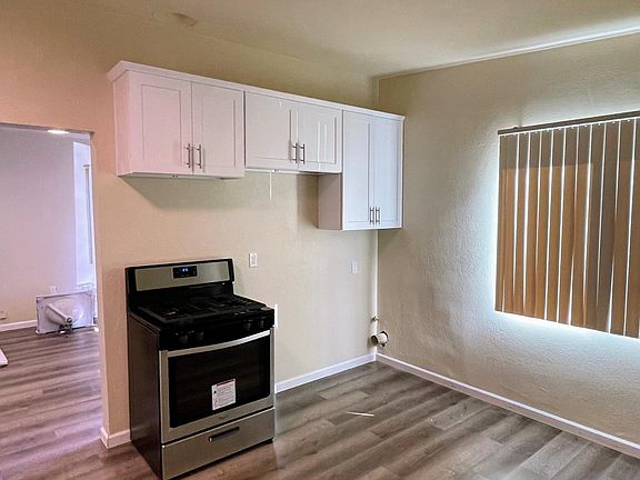 Range next to Fridge and Dryer Hookup