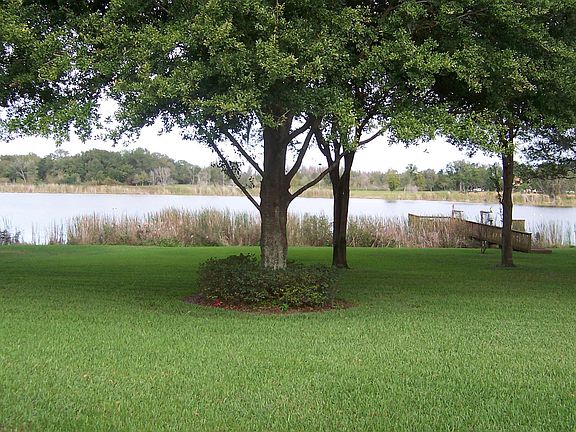 Expansive backyard with dock and boat lift