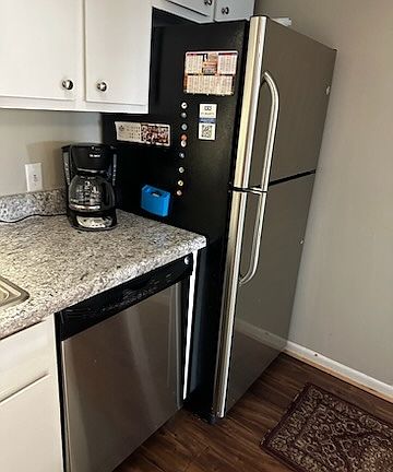 Stainless steel dishwasher and refrigerator. Apologies...stainless steel sink, electric oven and microwave photos were too small to present here.