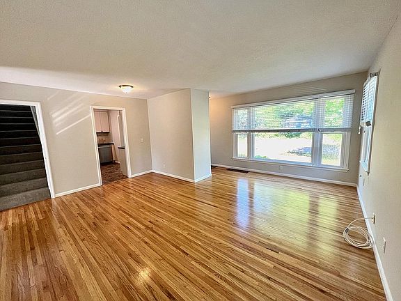 Living Room with solid oak floors/new neutral paint/enameled woodwork!