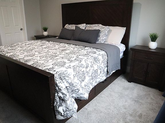 Master Bedroom with a King size bedroom. Plenty of storage under bed, nightstands, a dresser and a walk in closet.