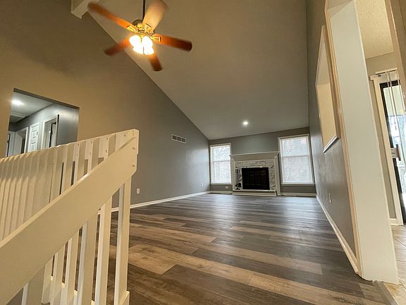Living room with high vaulted ceiling