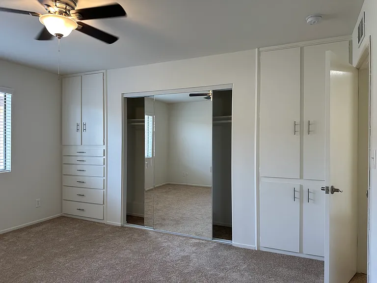 Mirrored Closet Doors, Built in Deep Cabinets and Drawers