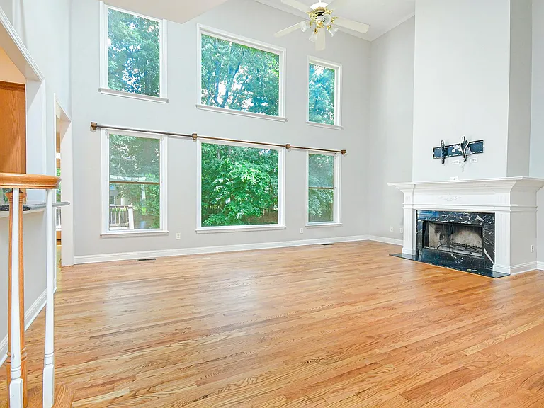 Large windows with a private view of the backyard.