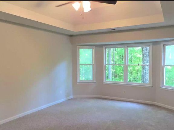 Master bedroom faces private fenced back yard