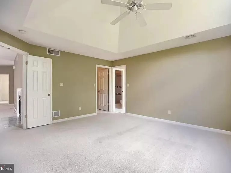 Master bedroom with walk-in closet and bathroom
