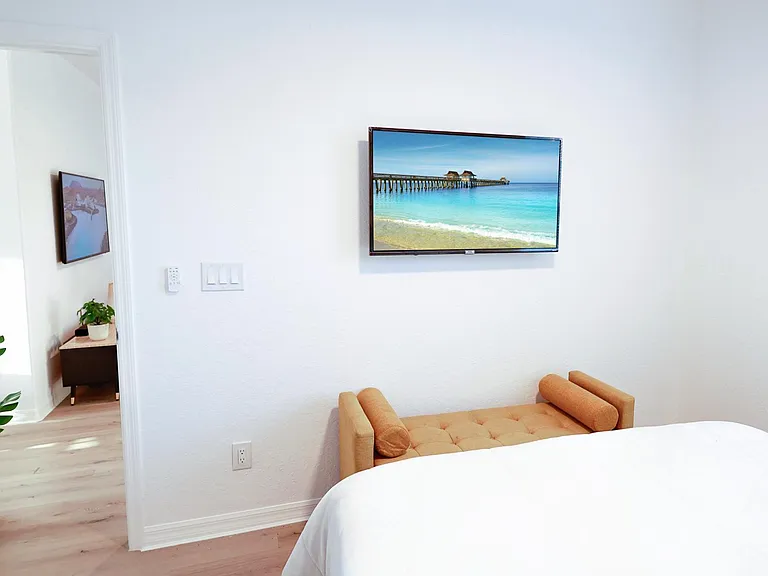 Each bedroom features a queen sized bed, a wall mounted Smart TV, and plenty of closet space.