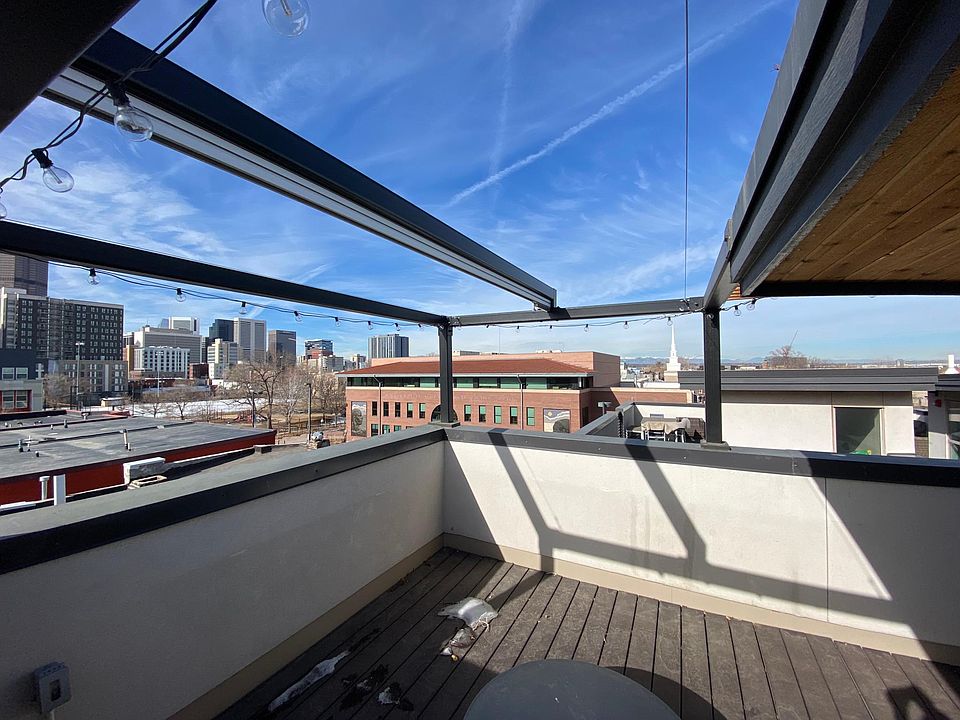 Roof Deck retractable shade seating area. Shade is in storage for winter