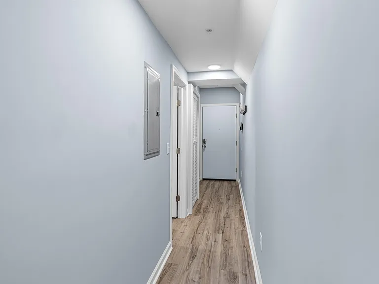 Hallway looking at entry door