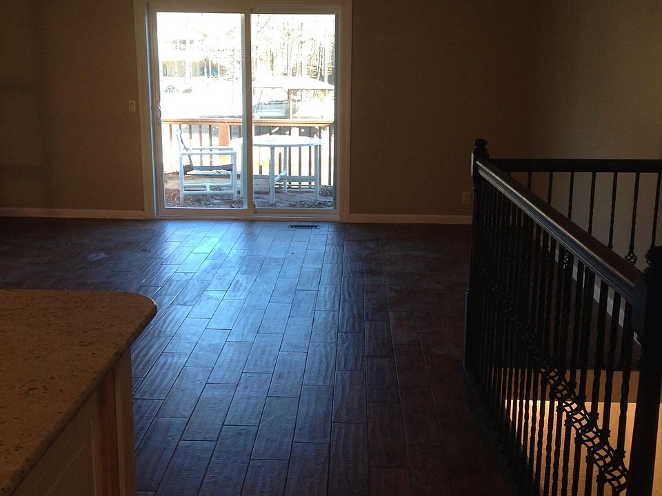 Living area with sliding glass doors to upper deck.