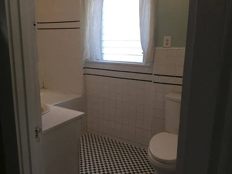 Upstairs bathroom in tile.