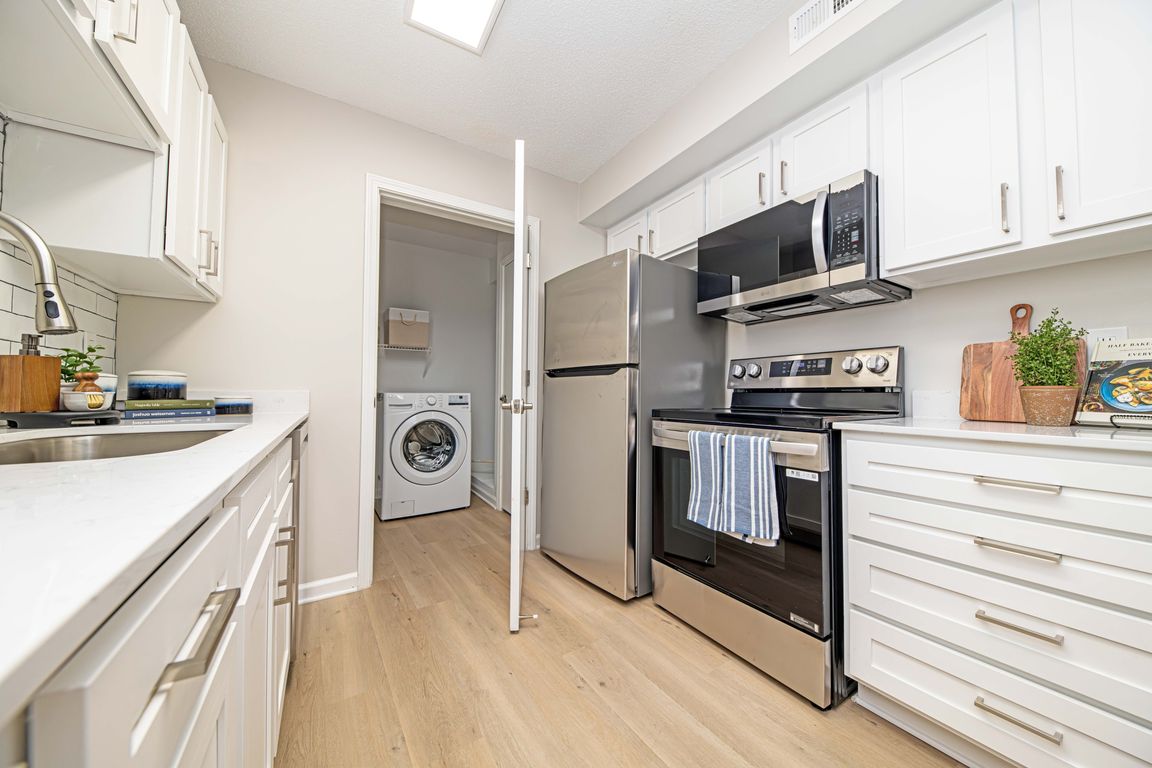 Stainless appliances and modern cabinetry