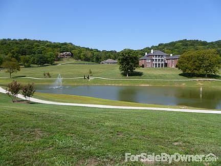 Fantastic views from the lot!
						:
						Lot slopes gently to walking paths around the lake.