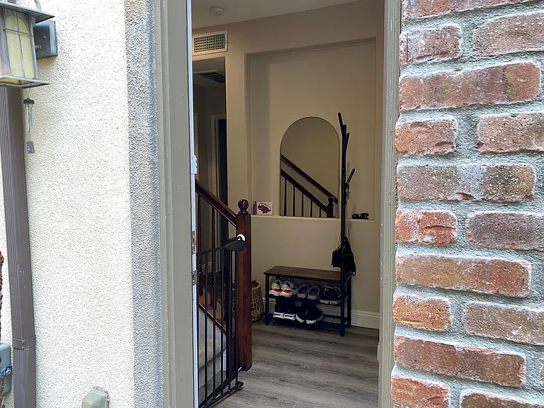 The door between the ground floor patio and the main entrance of the house.