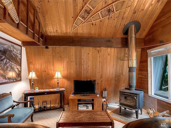 Relax in front of the wood-burning stove will watching the snow fall at this perfect mountain cabin.  