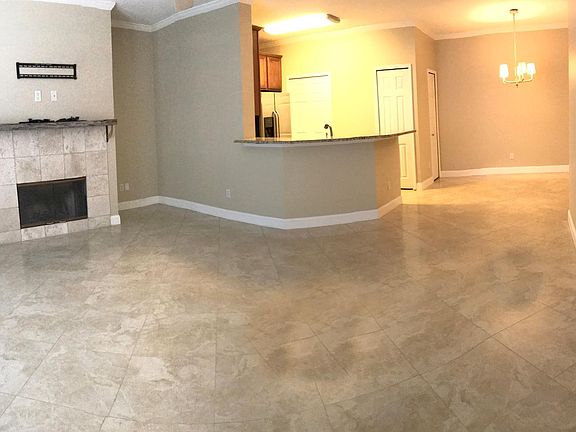 Living room, dining area and kitchen